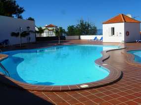 Apartment with terrace, garden and pool above Las Americas